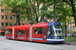 A Skoda 10T operating in Portland. It holds 200 people max, about 50% more than an articulated bus, but fits well on a narrow street.
